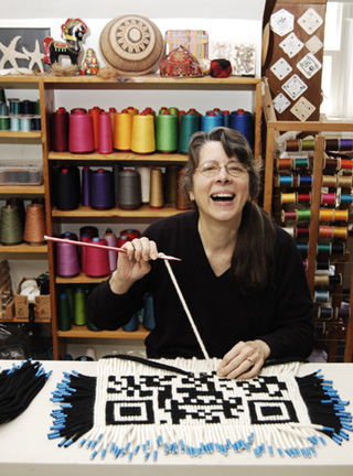 Linda demonstrating ply-splitting QR code