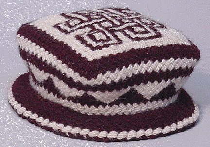 [TLOI hat with eternal knot design -- side view]